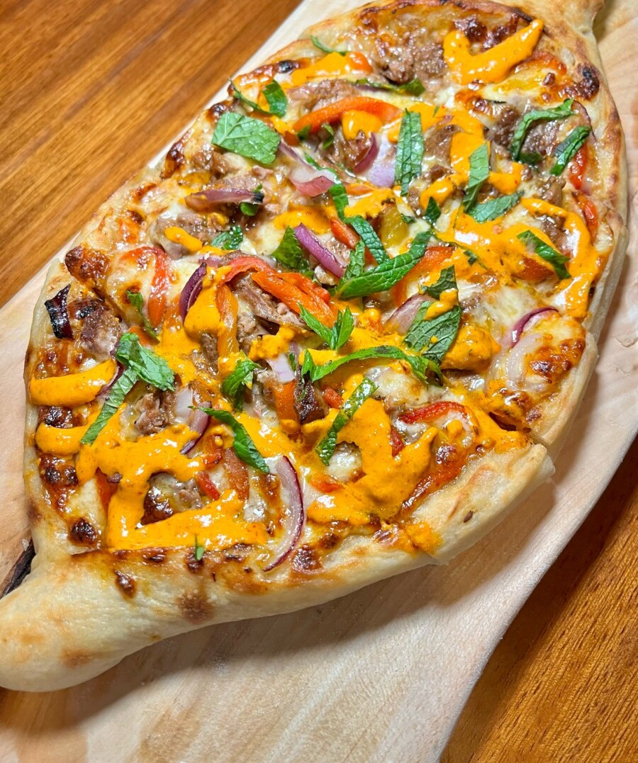 Shawarma lamb pizza: a tantalizing fusion of Mediterranean and Italian cuisines"