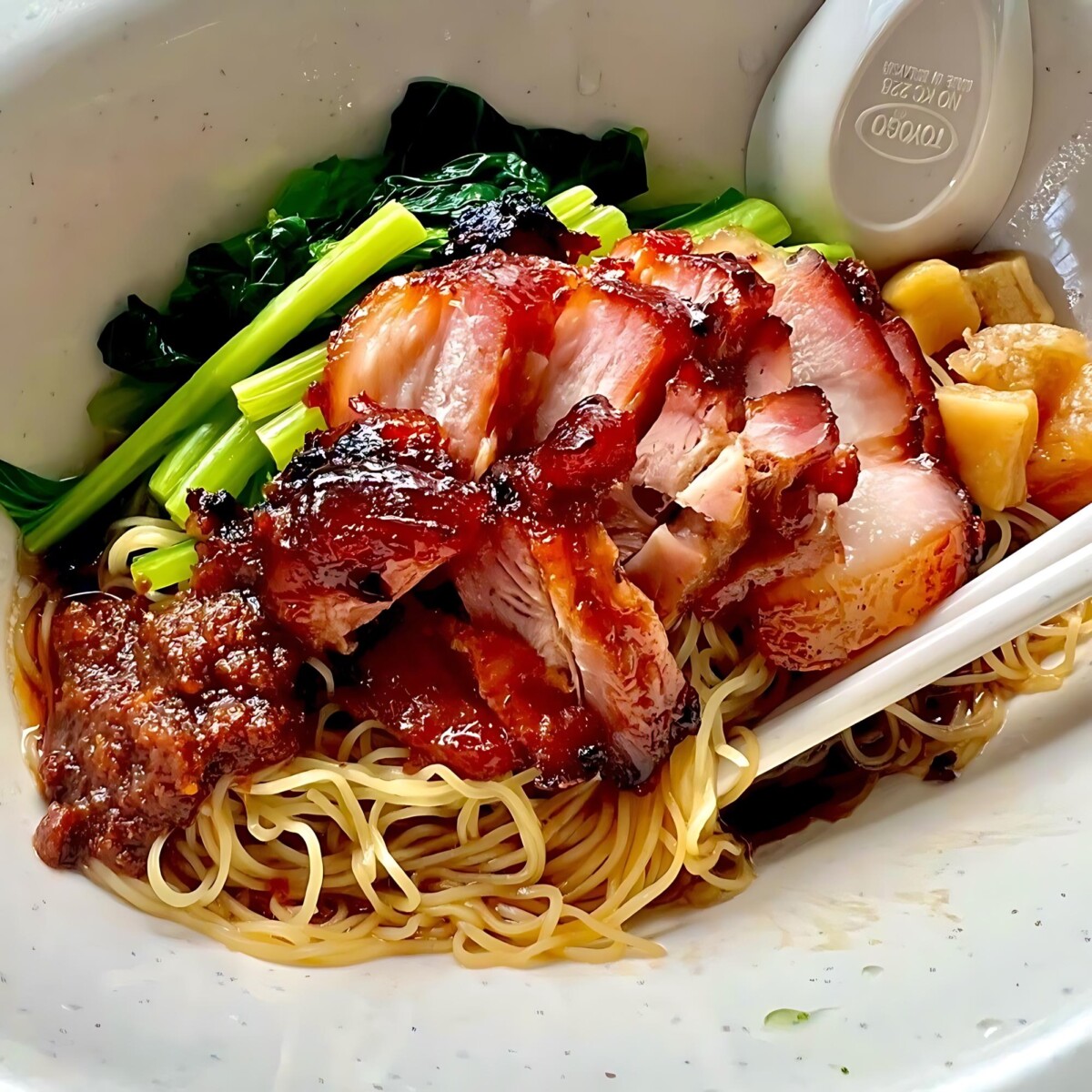 Springy noodles, juicy wontons & glistening char siew - a hawker hero awaits!