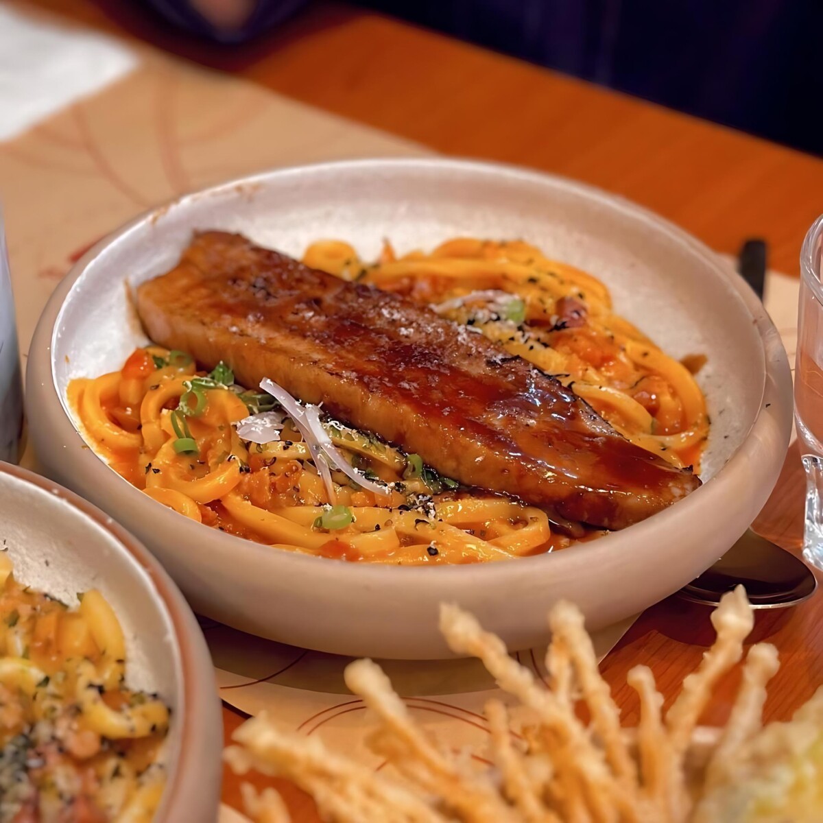 Try their signature spicy carbonara udon!