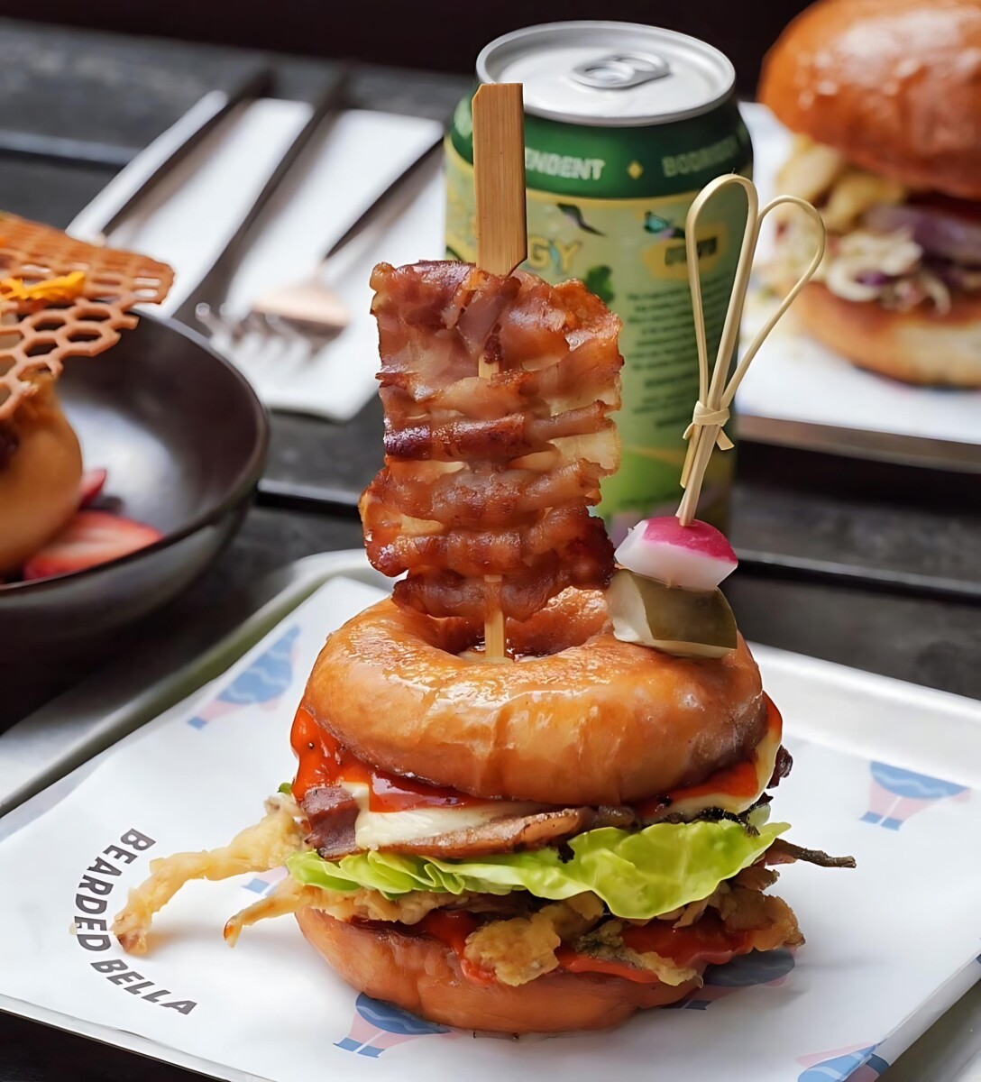 Indulge in quirky brunch delights and savour their doughnut burger.