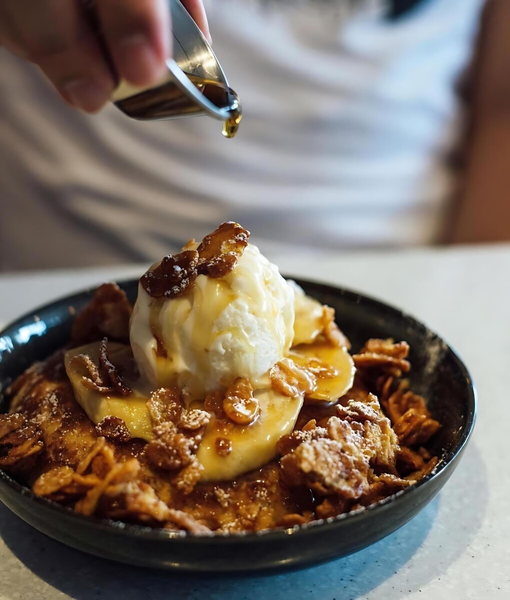 Indulge in a sweet and comforting treat with Apollo Coffee Bar's Butterscotch Banana Pancake.