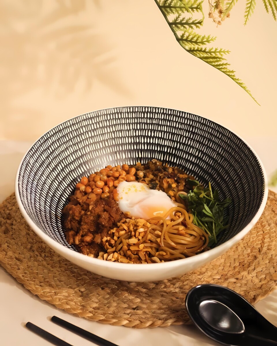 Spice up your day with Typhoon Cafe's Dan Dan Mazeman, a flavourful egg-based dish.